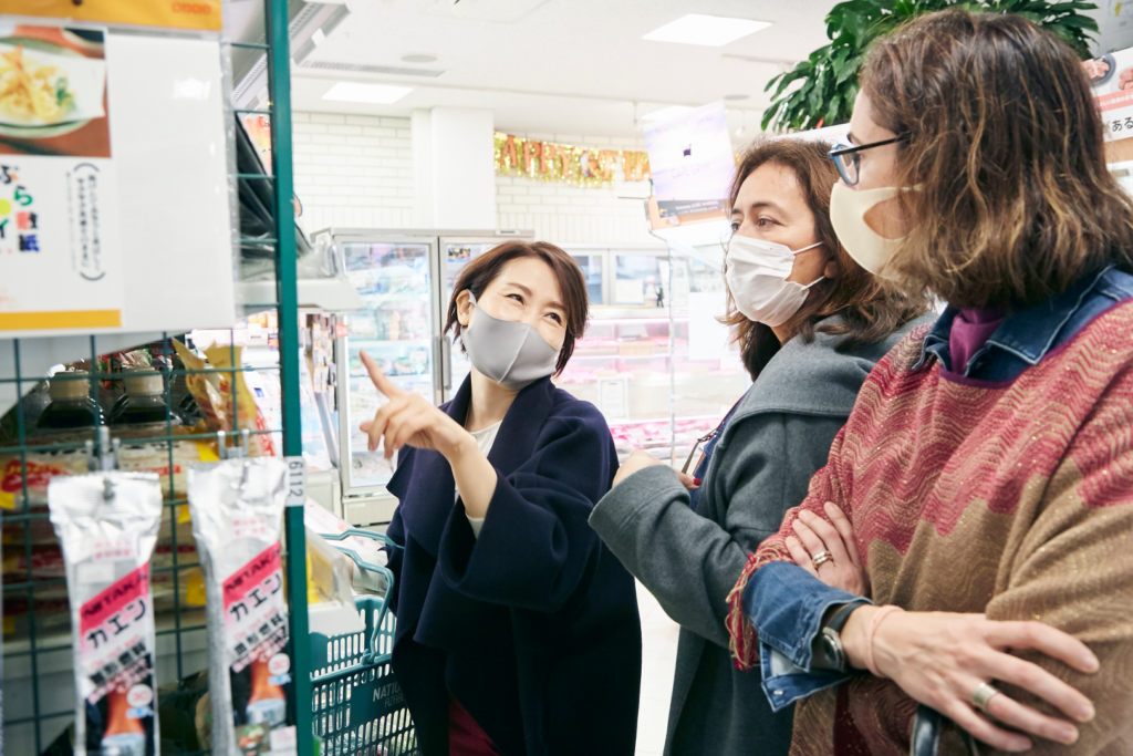 a teacher and students of Toranomon Language School talking in a shopping tour